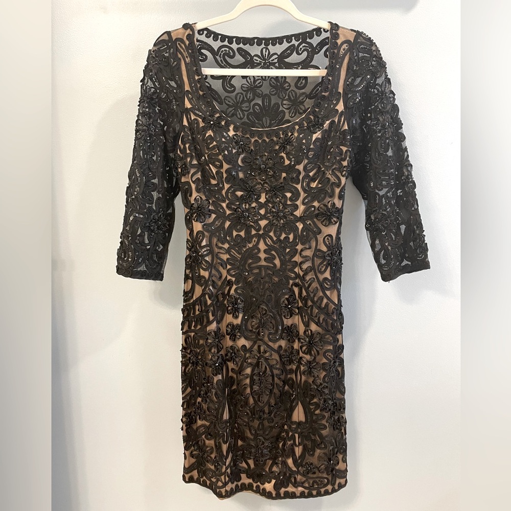 Black appliqué and beaded dress